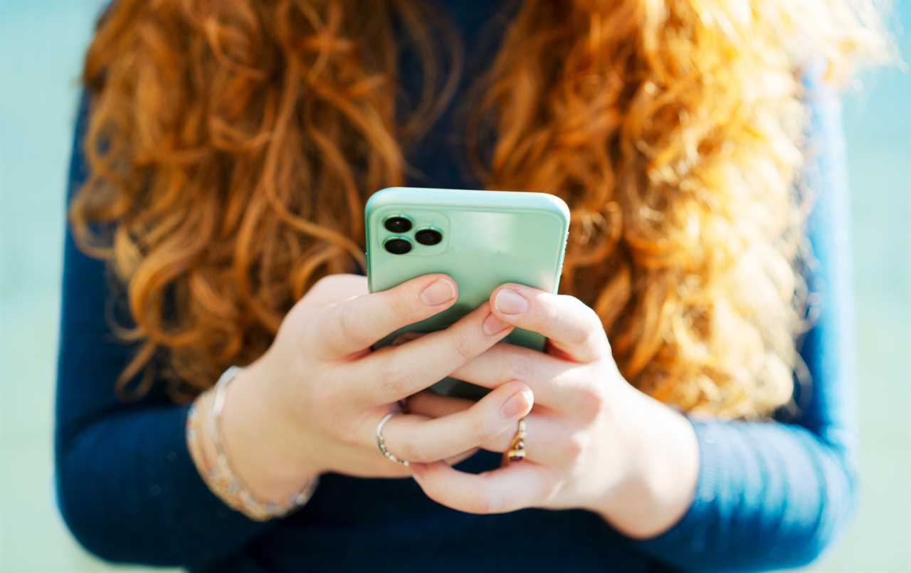 Close up on woman using smart phone