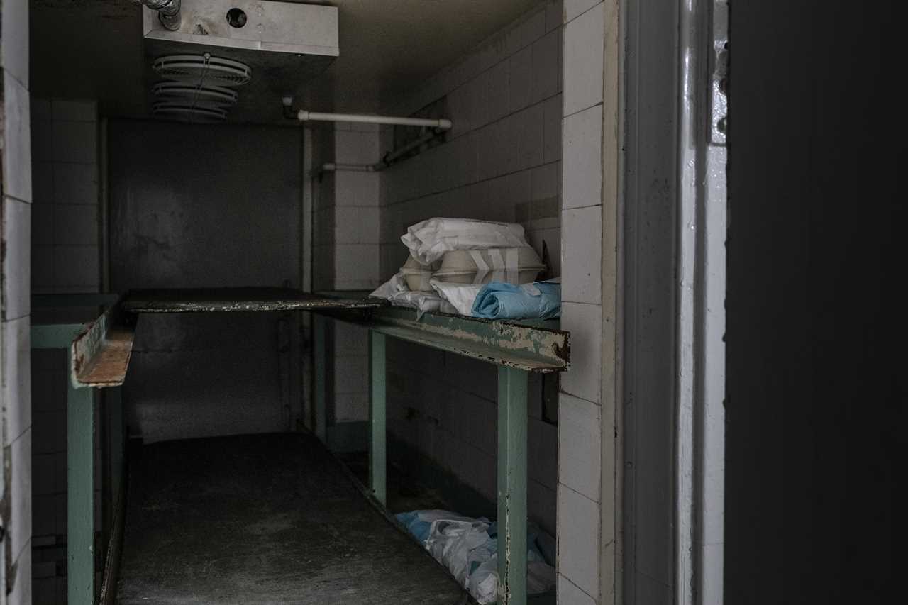 About 20 fetuses wrapped in cloth and paper in a fridge at a hospital morgue. The fetuses, many of which were born prematurely or with severe malformations, were abandoned. 