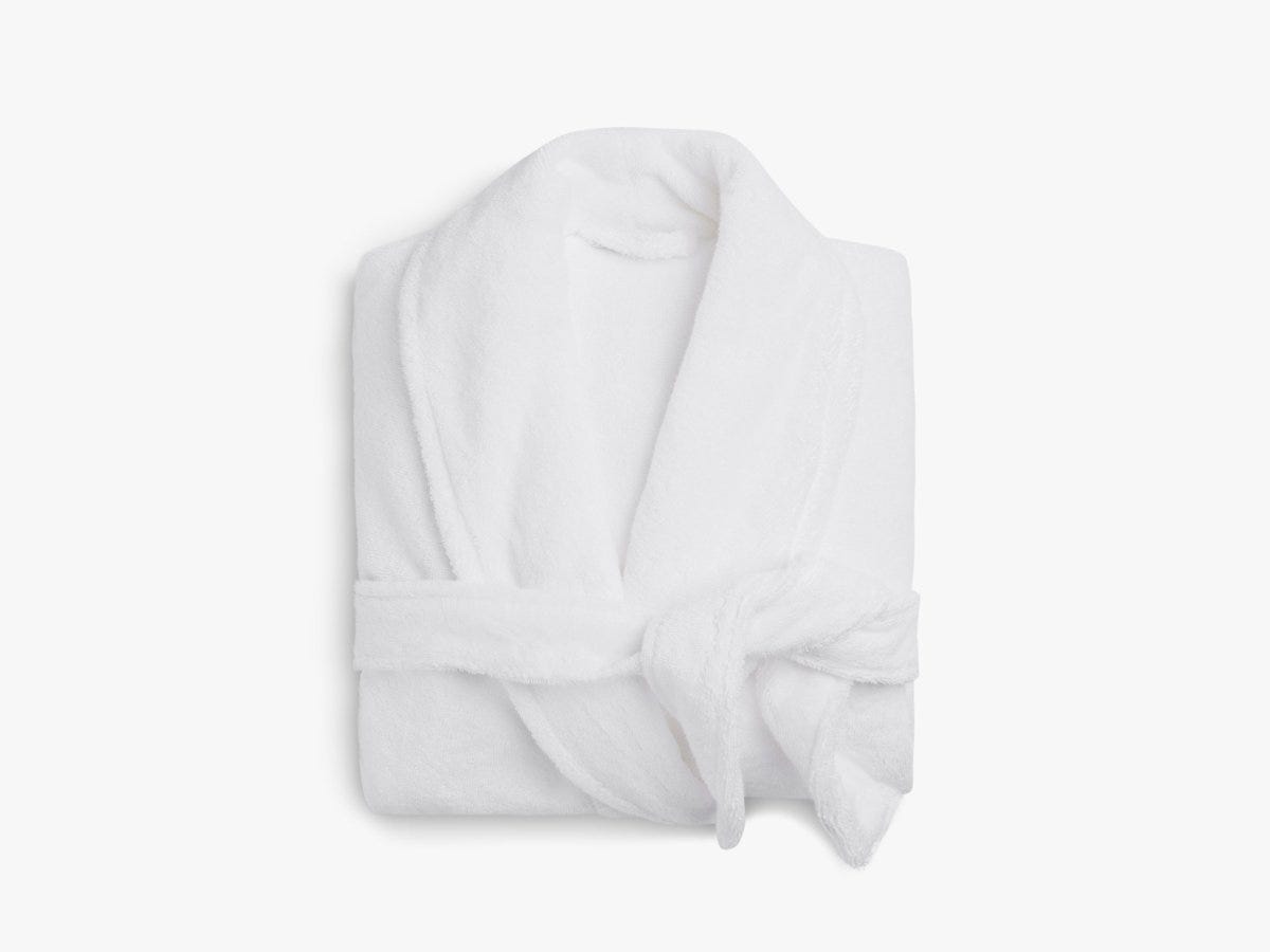 A folded white cotton robe.