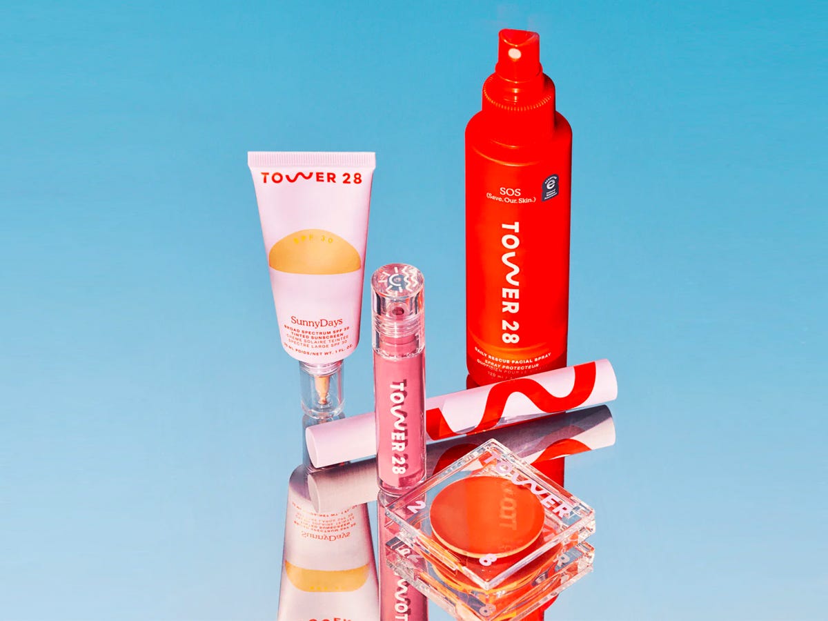 Tower 28 Essentials Kit including a the SunnyDays SPF 30 Tinted Sunscreen, BeachPlease Tinted Balm, ShineOn Lip Jelly, MakeWaves Mascara, and a travel-size SOS Daily Facial Rescue Spray.