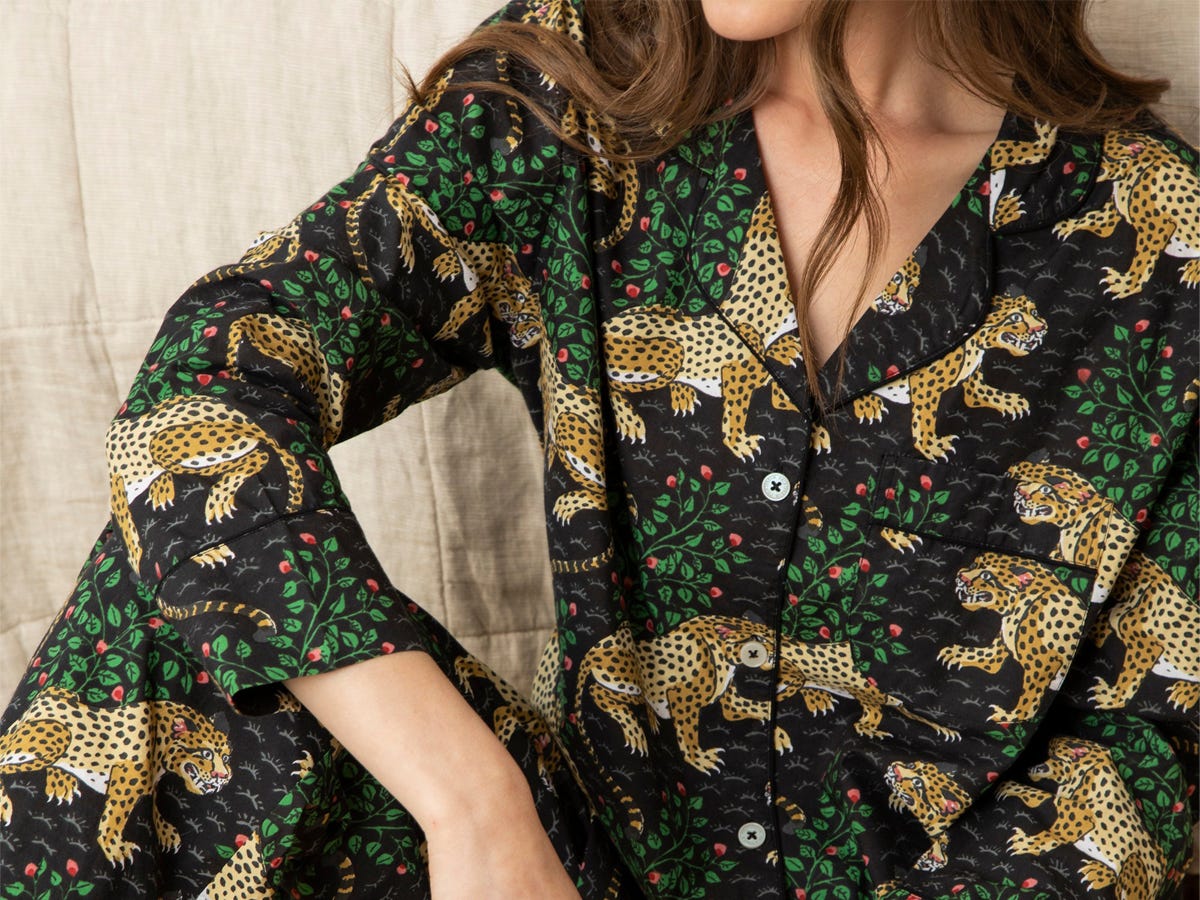 A person sitting down while wearing the Printfresh Long Sleep Set.