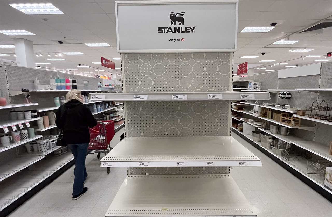 A shopper passes empty shelves once stocked with Stanley insulated steel tumblers at a Target store on Tuesday, Jan. 9, 2024 in Canoga Park, CA.