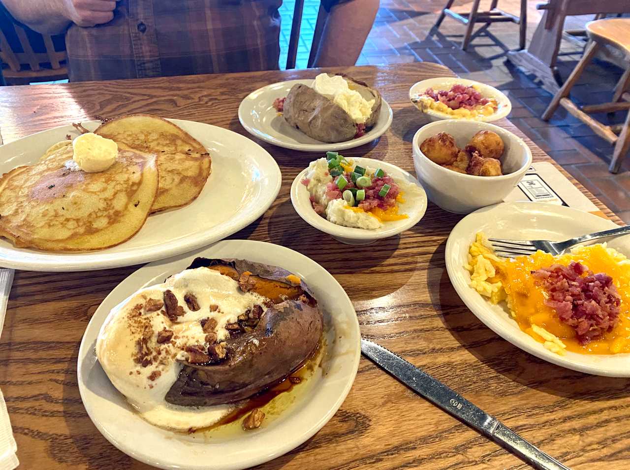 7 plates of different side dishes at cracker barrel