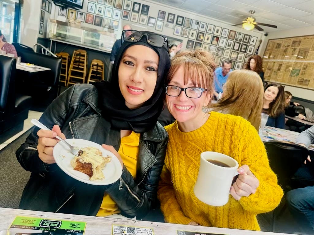 Samantha Salem and Jess Rodenburg share a meal in a diner