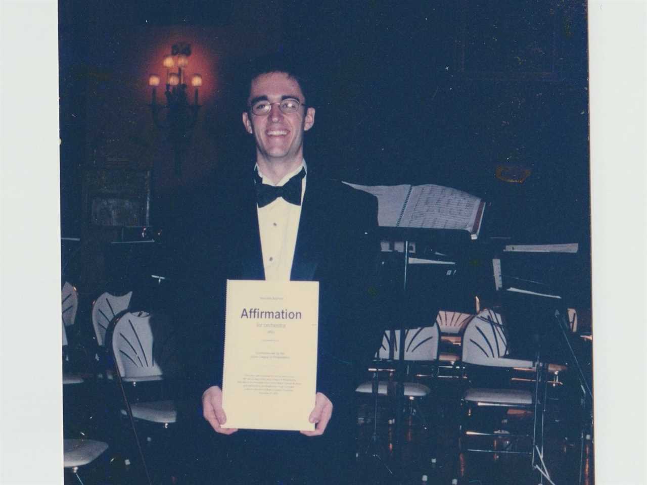 Man posing in a tuxedo