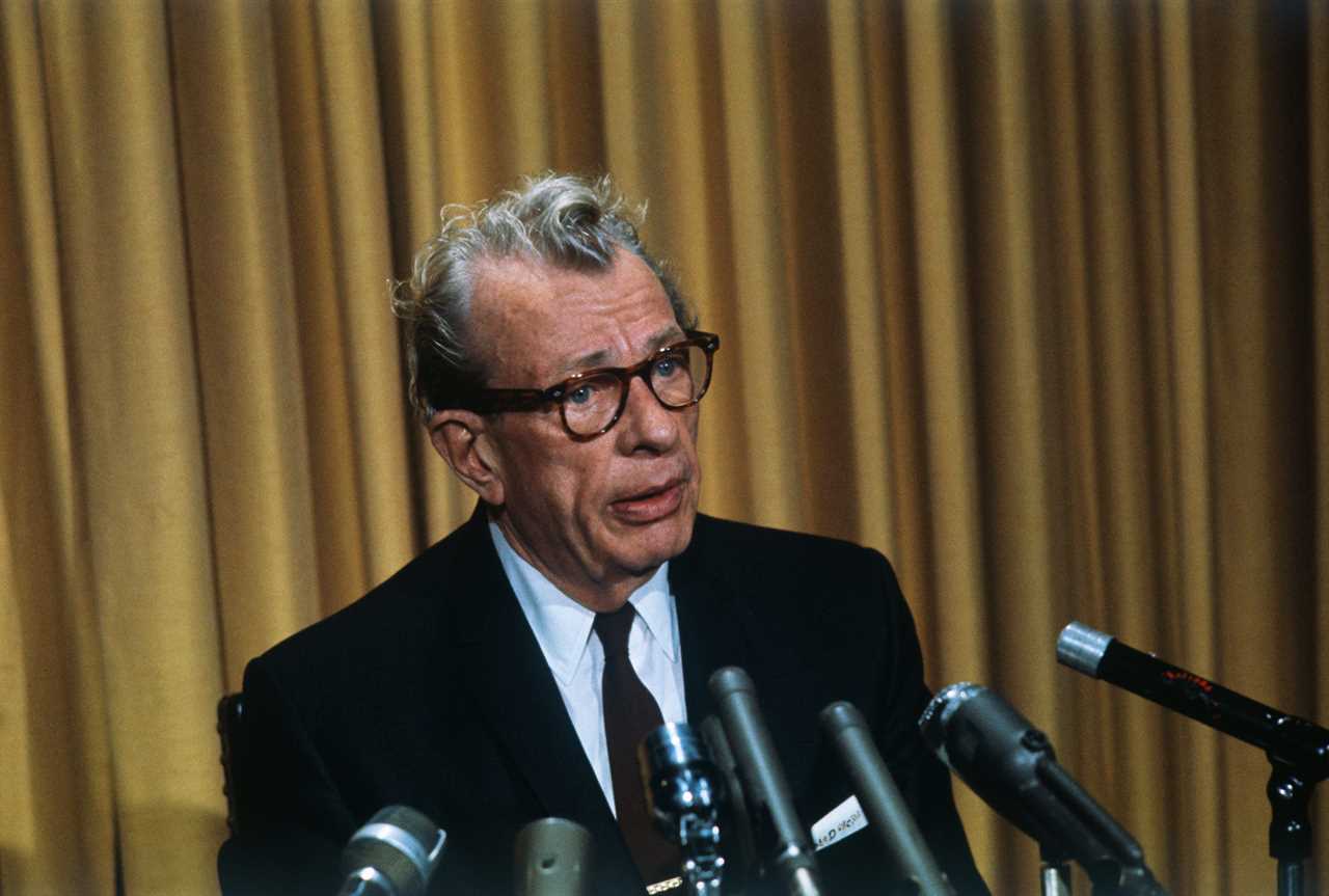 Sen. Everett M. Dirsen, Republican from Illinois, speaks in front of several microphones.