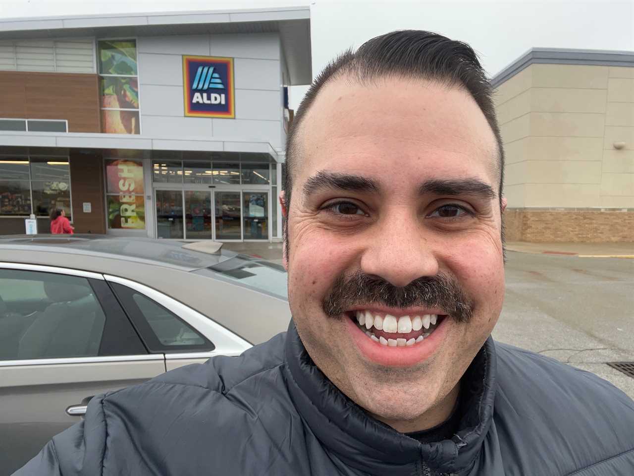 A selfie of Jake in front of an Aldi store.