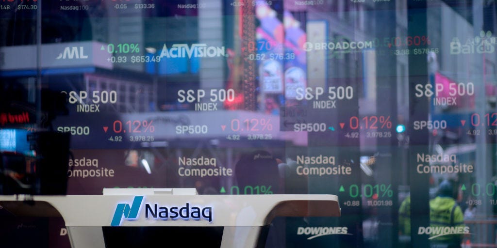 Company names and logos are on display at the Nasdaq MarketSite at Times Square in New York City.