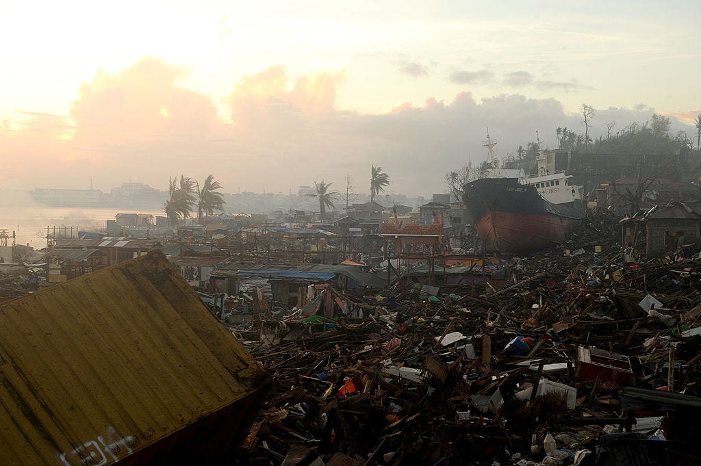Rubble from destroyed buildings litter the ground after Typhoon Haiyan came through.