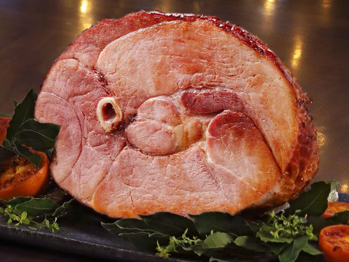 A profile view of a cut Kurobuta Half Ham at Snake River Farms.