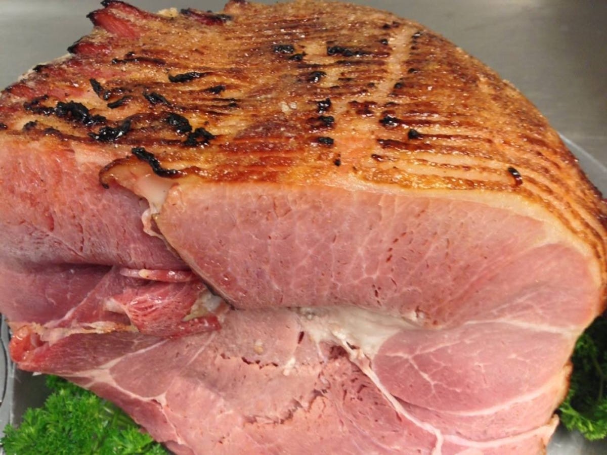 View of a Cajun Ed’s Cajun Honey Glazed Ham cut to reveal the inside.