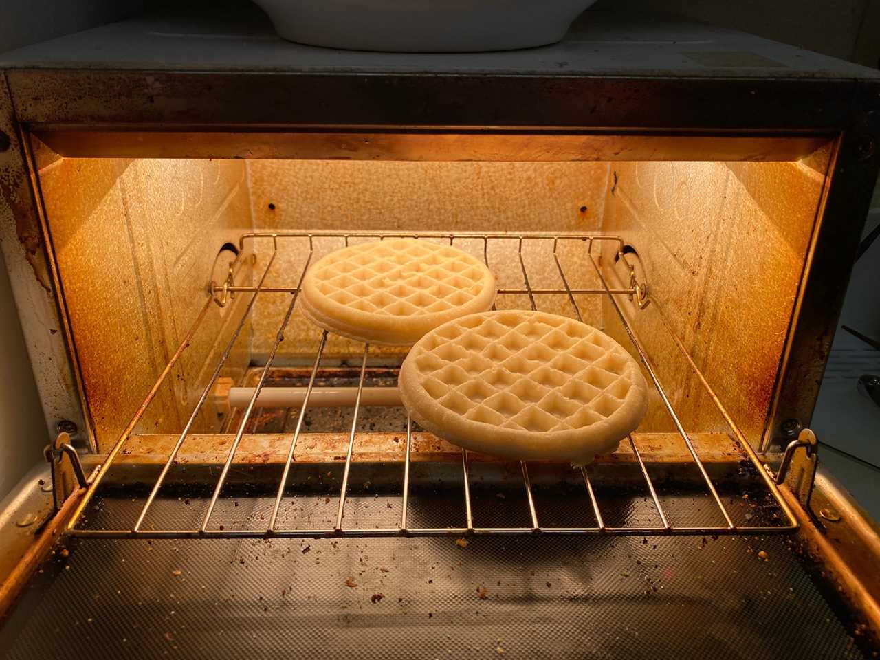 two frozen waffles in a toaster oven