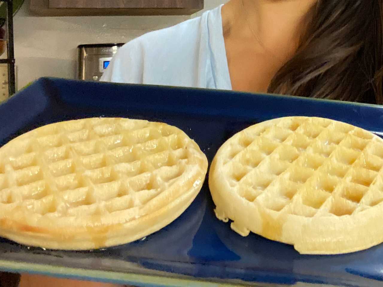 two frozen waffles on a blue plate