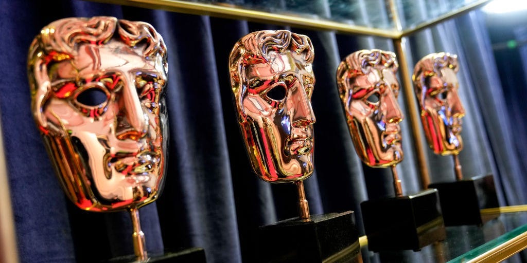 A row of BAFTA award trophies