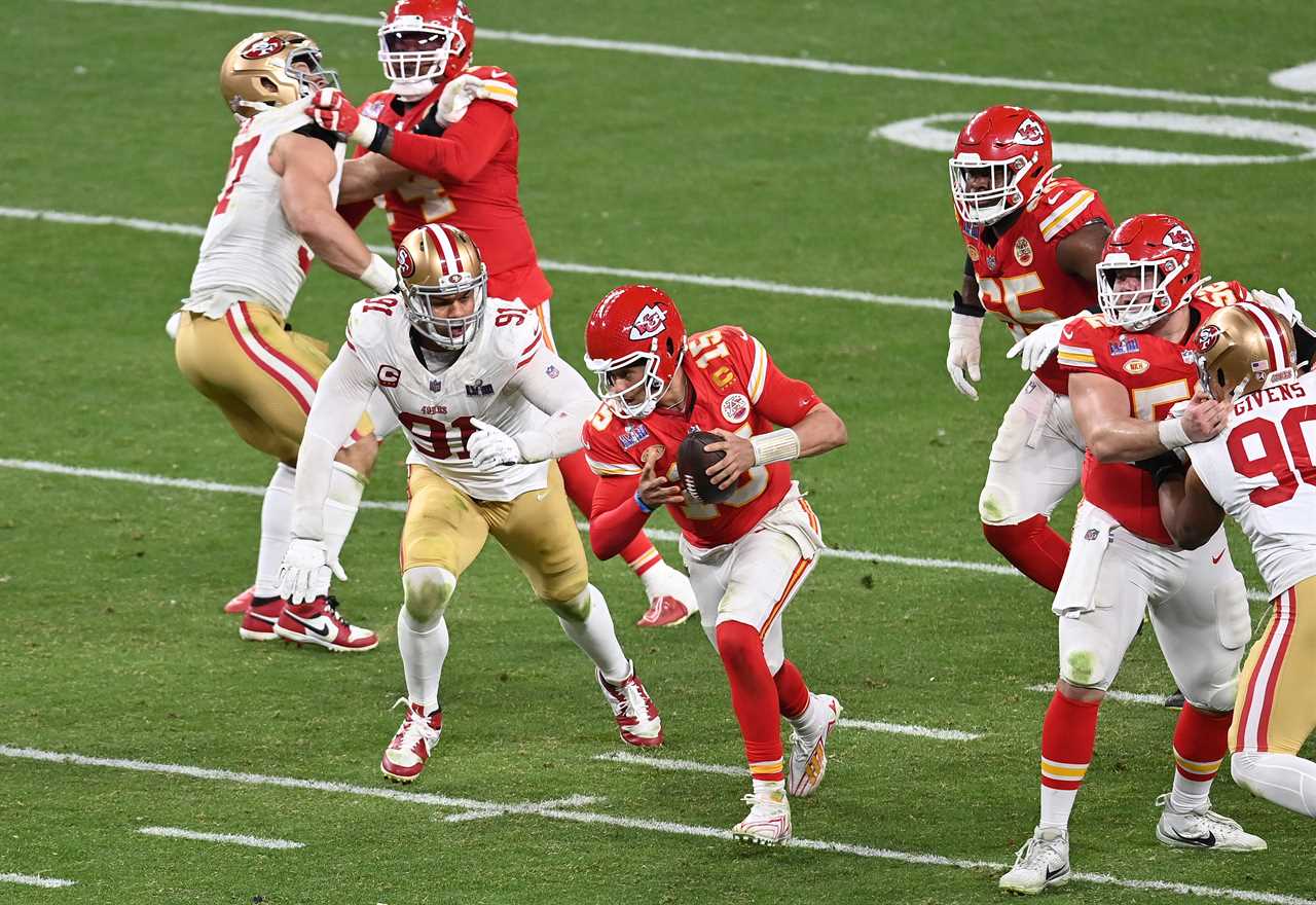 Patrick Mahomes #15 of the Kansas City Chiefs scrambles with the ball against the San Francisco 49ers