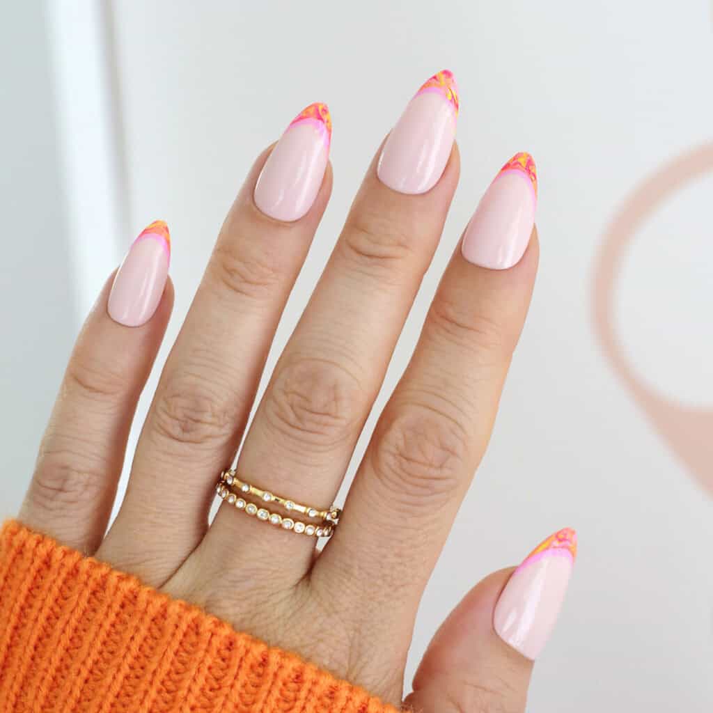 orange and pink marbled nails